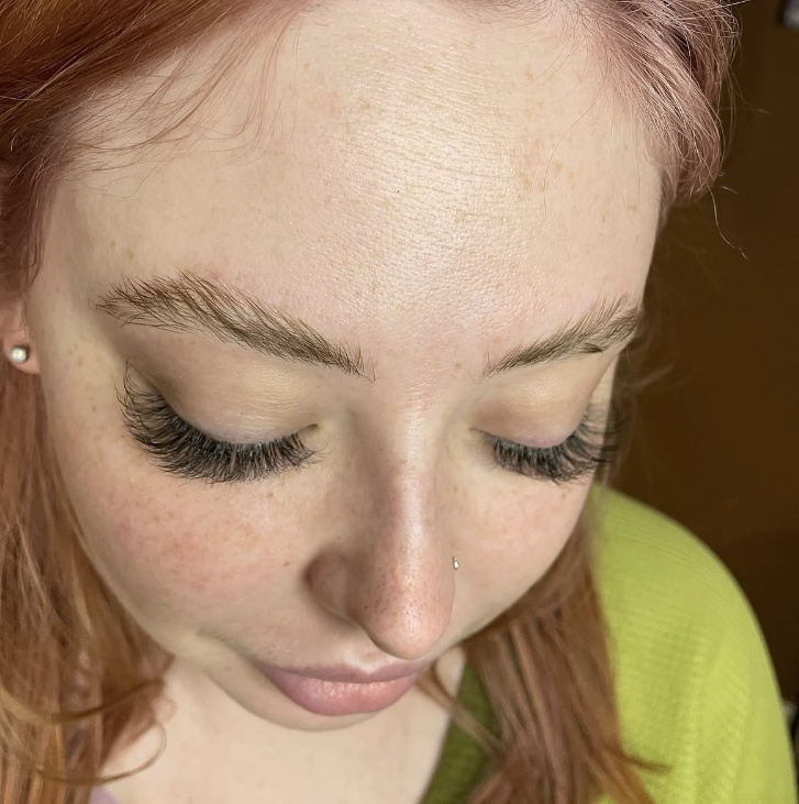 Natural lash extensions on client